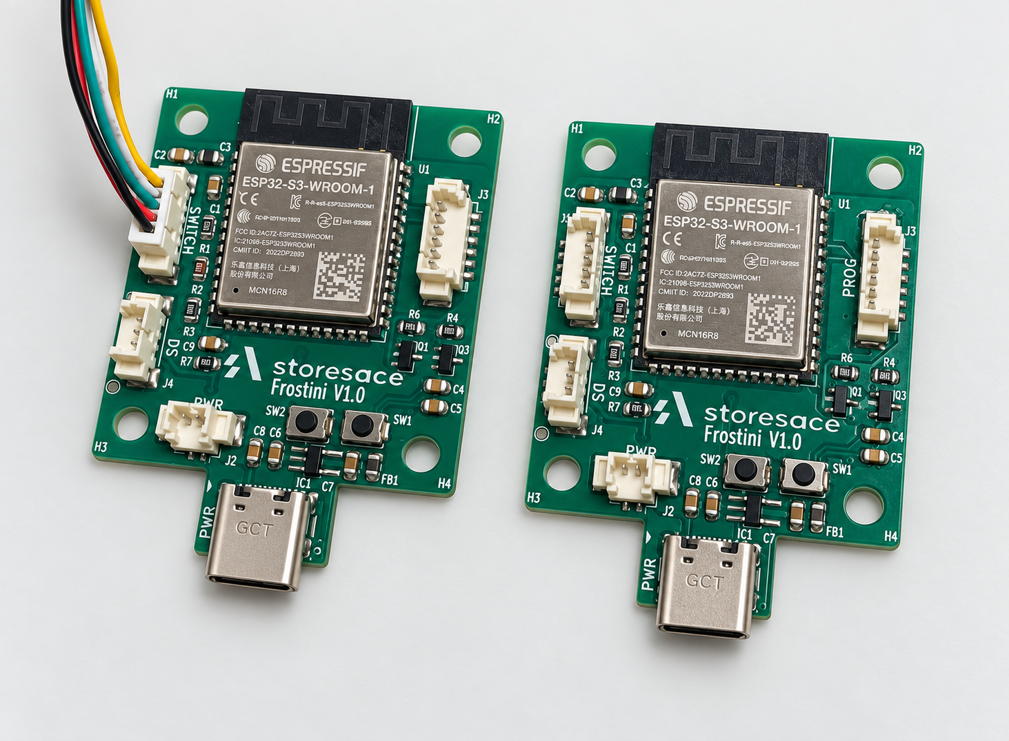 Two Frostini ESP32-S3 temperature monitoring boards, one connected to a DS18B20 temperature sensor